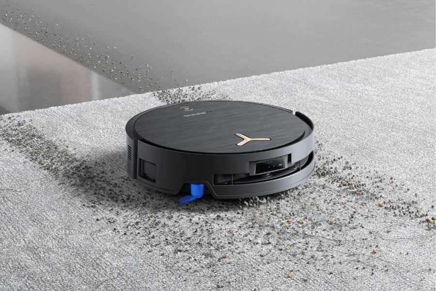 deebot robot vacuum cleaning debris on carpet